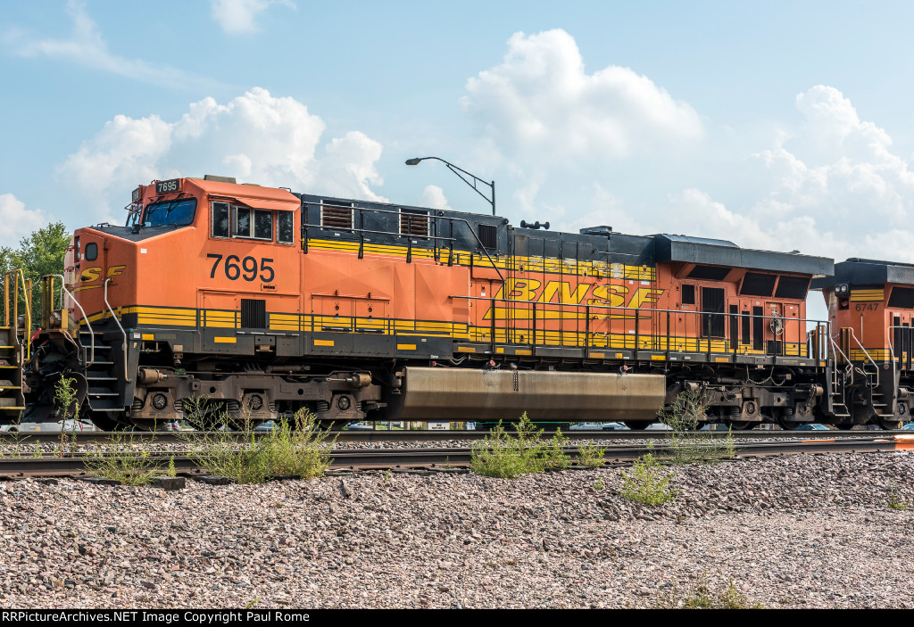 BNSF 7695, GE ES44DC, wearing experimental yellow BNSF 'Golden Swoosh' logo 